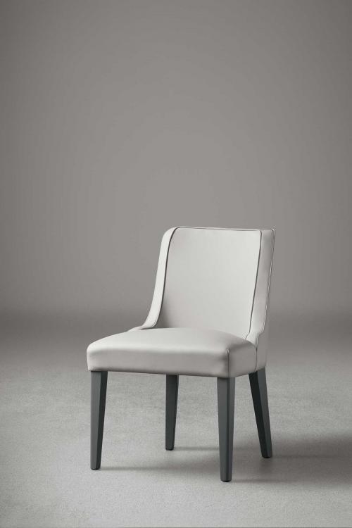 Isabey chair with Cemento lacquered legs and covered in leather