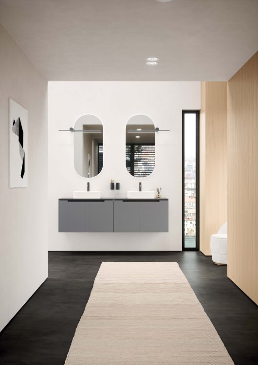 Profilo vanity unit in matt Grigio Pietra lacquered finish, Top in Grigio Pietra colored Purefeel, Leaf countertop washbasin in white Lightfeel, Hugo Mirror