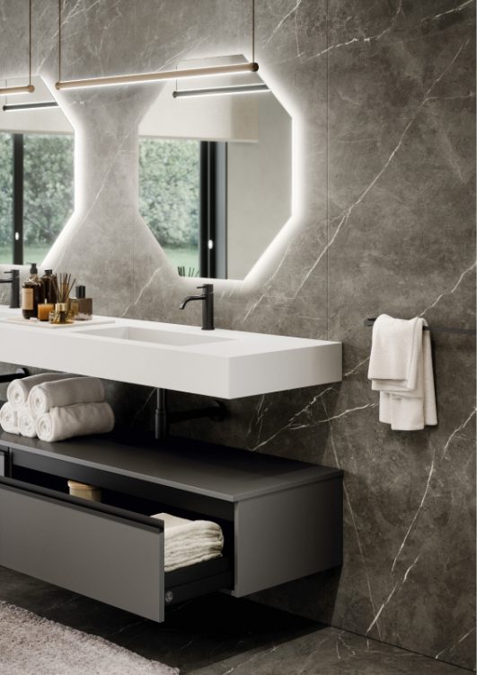 Suspended top in matt white Purefeel with Nick integrated washbasin, additional wall hung base unit in matt Grigio Pietra lacquered finish, Jung mirrors, Sei lamps